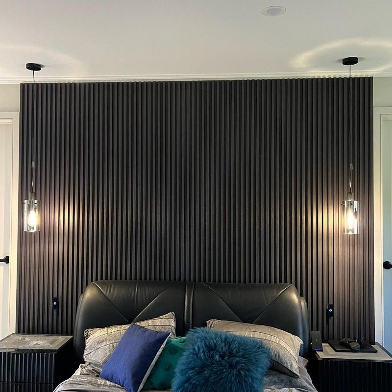 Black batten bedhead wall with matching pendant lights, seen front-on