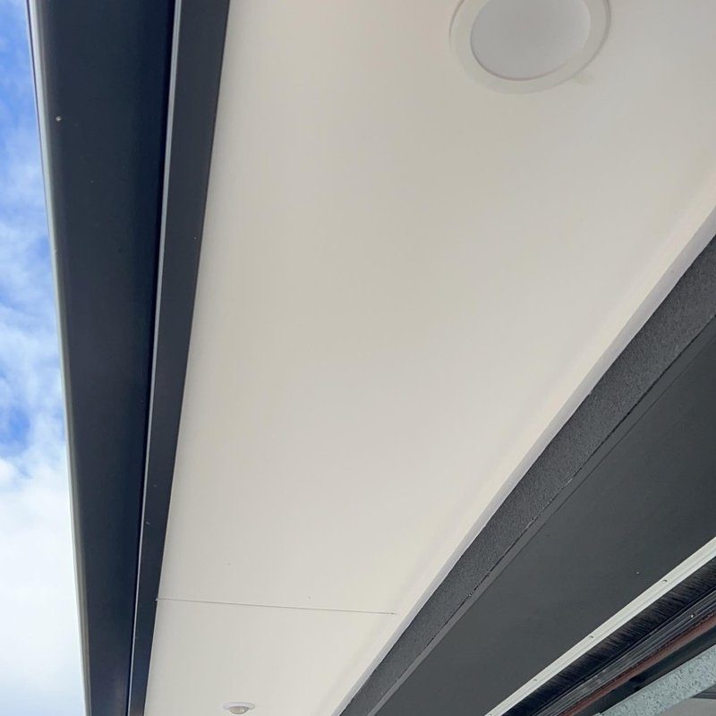 Downlight set into an outdoor eave, seen from below